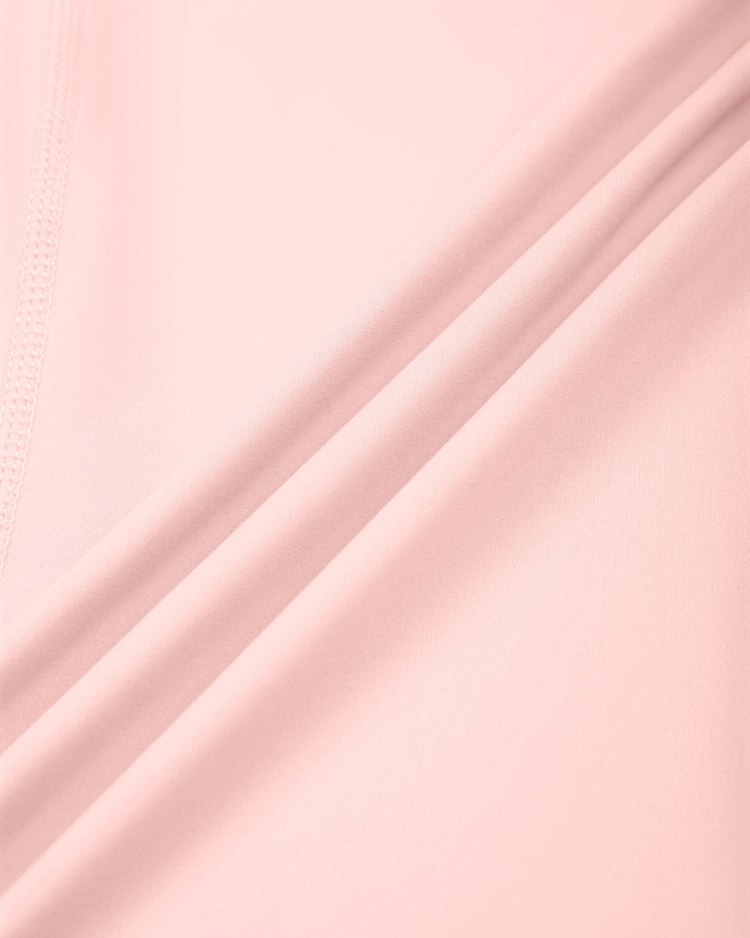 Closeup of smooth pink nylon stretch fabric on Contour Yoga Leggings
