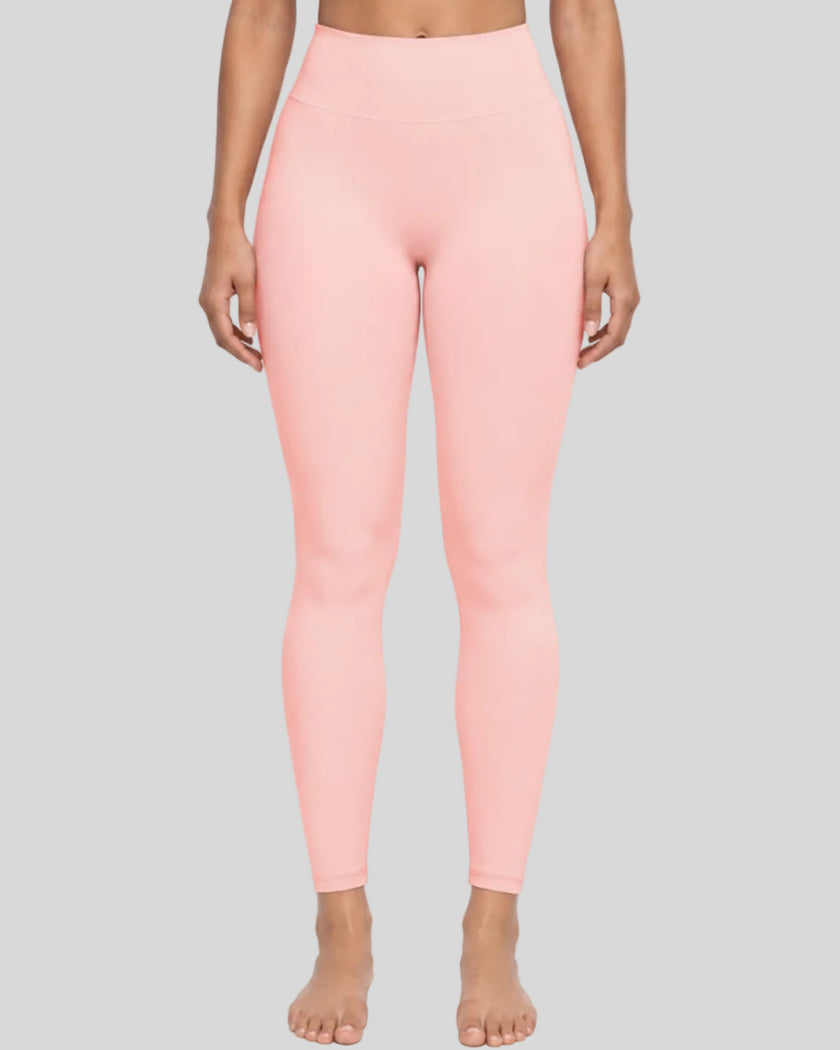Lower body front view of woman wearing Contour Yoga Leggings in pink
