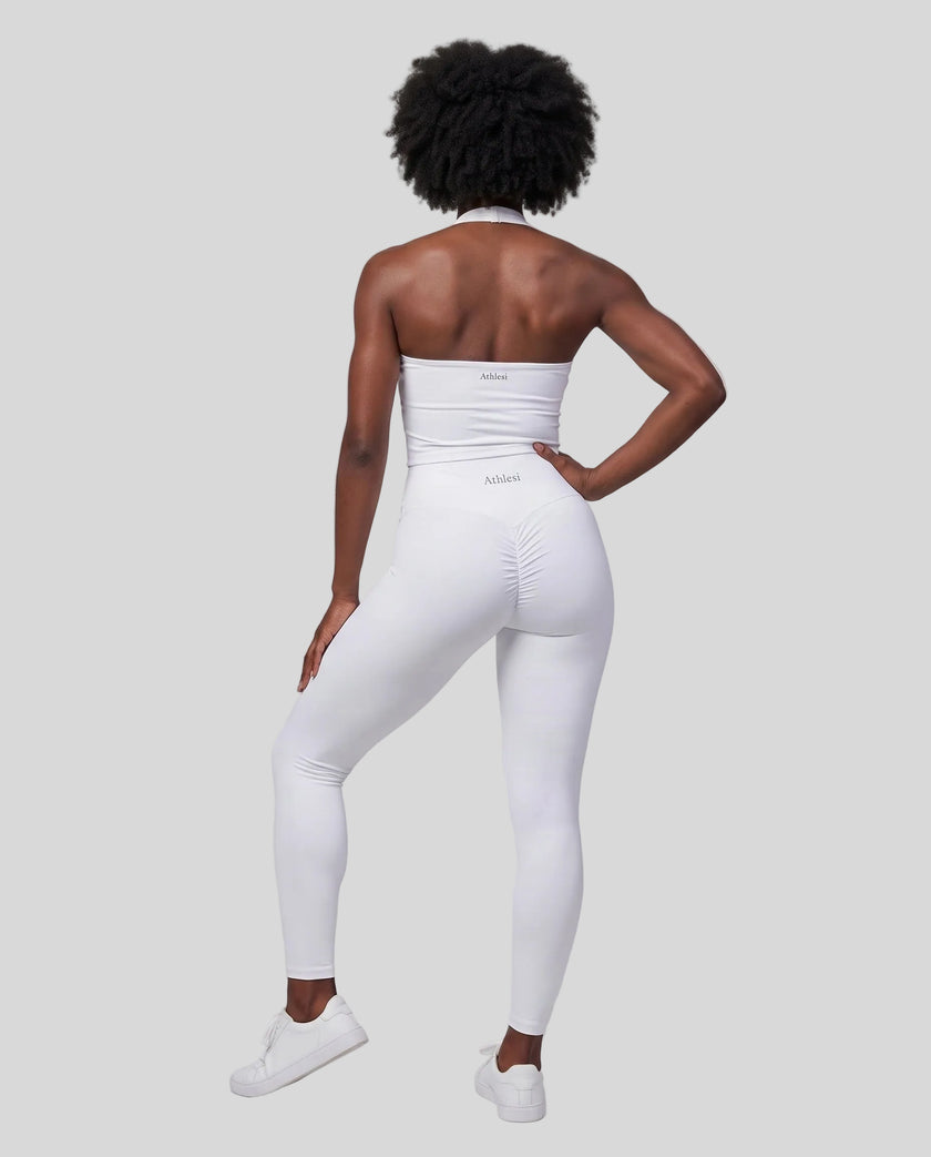 Full body back view of woman wearing Contour Yoga Leggings with matching Contour activewear in white