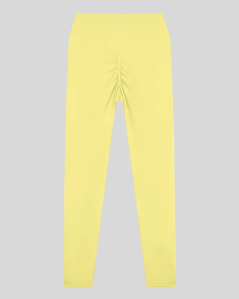 Contour Yoga Leggings in yellow with ruched back detail back view