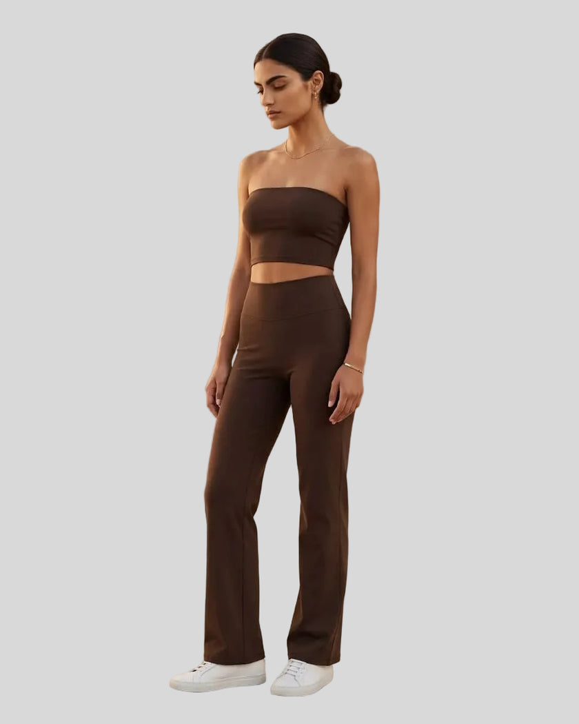 Front angle view of a model wearing the Contour Yoga Pants in Brown