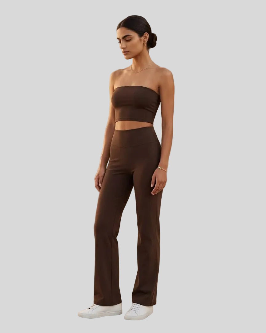 Front angle view of a model wearing the Contour Yoga Pants in Brown