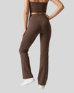Model wearing the Contour Yoga Pants in Brown, back lower body view.