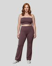 Model wearing the size large Contour Yoga Pants in Plum Purple, front full body view