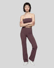 Model wearing the size small Contour Yoga Pants in Plum Purple, front full body view