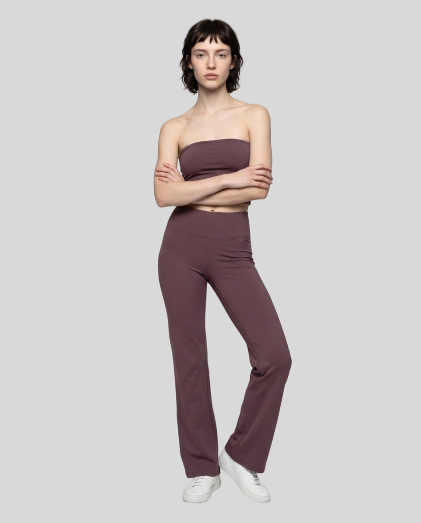 Model wearing the size small Contour Yoga Pants in Plum Purple, front full body view