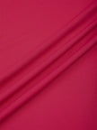 Close-up of the smooth stretch performance fabric on the Contour Yoga Pants in Rose Red