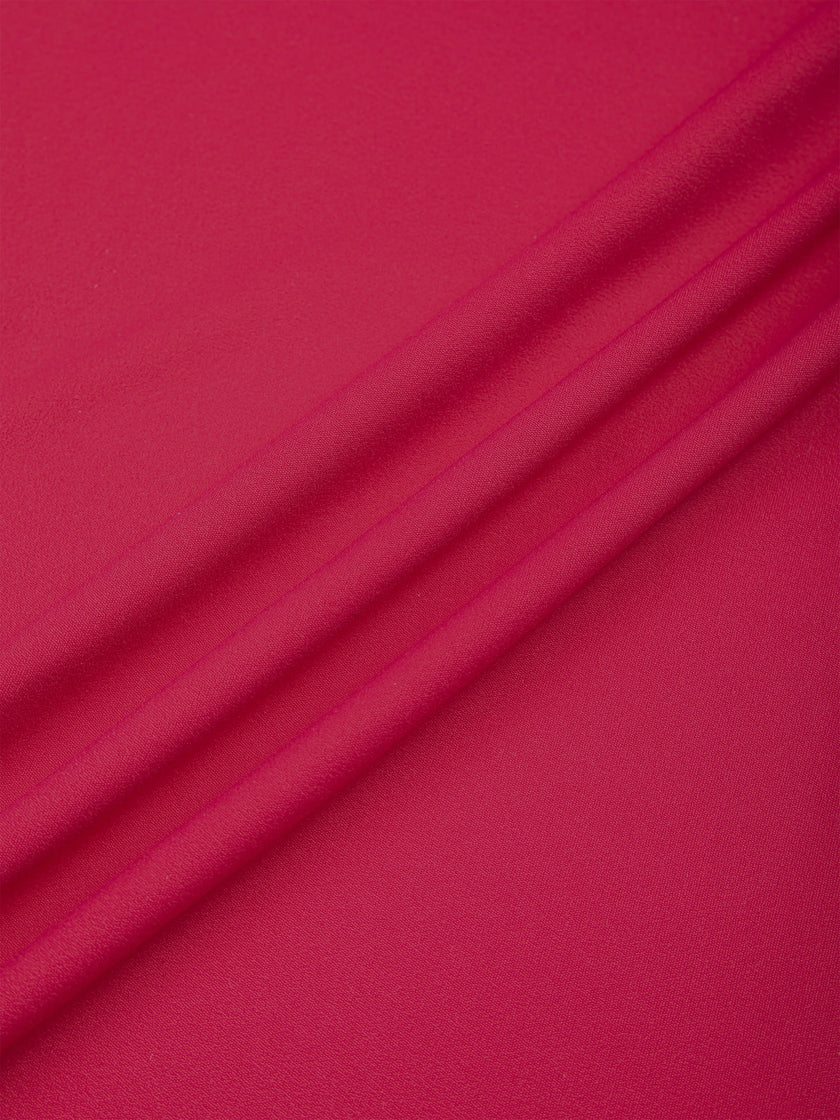 Close-up of the smooth stretch performance fabric on the Contour Yoga Pants in Rose Red