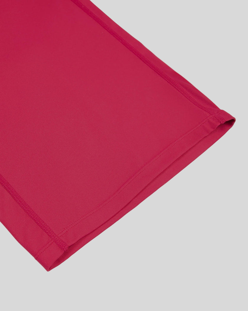Close-up of the straight leg hem on the Contour Yoga Pants in Rose Red
