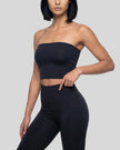 Model wearing the Contour Yoga Tube Top in Black, front view
