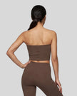 Back view of a model wearing the Contour Yoga Tube Top in Brown