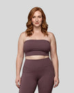 Model wearing the Contour Yoga Tube Top in Plum Purple, front view