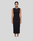 Woman wearing the ContourEase Ruched Maxi Dress in Black, front view showing slim fit and side ruching