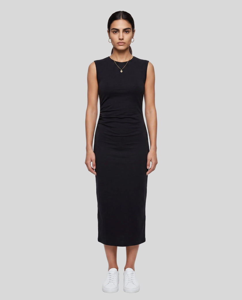 Woman wearing the ContourEase Ruched Maxi Dress in Black, front view showing slim fit and side ruching