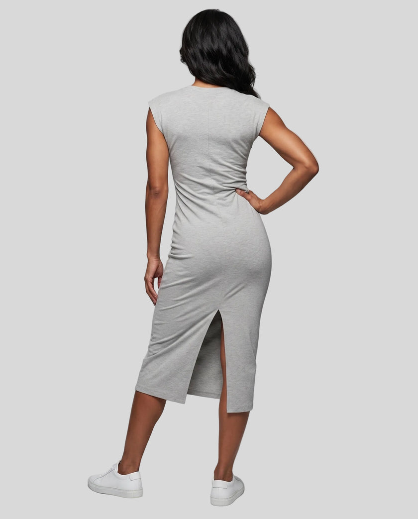 Woman wearing the ContourEase Ruched Maxi Dress in Flower Gray, back view showing the streamlined silhouette
