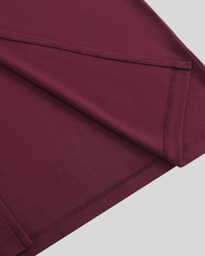 ContourEase Ruched Maxi Dress in Wine Red, closeup of straight hem and side slit detail