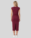 Woman wearing the ContourEase Ruched Maxi Dress in Wine Red, back view showing the streamlined silhouette