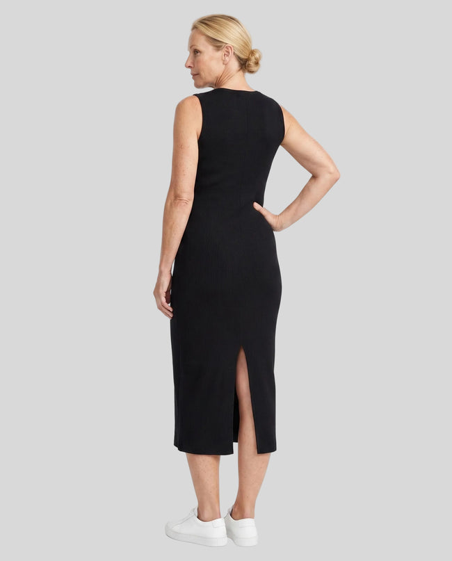 Woman wearing the ContourEase Sleeveless Maxi Dress in Black, back view showing slim silhouette and back slit