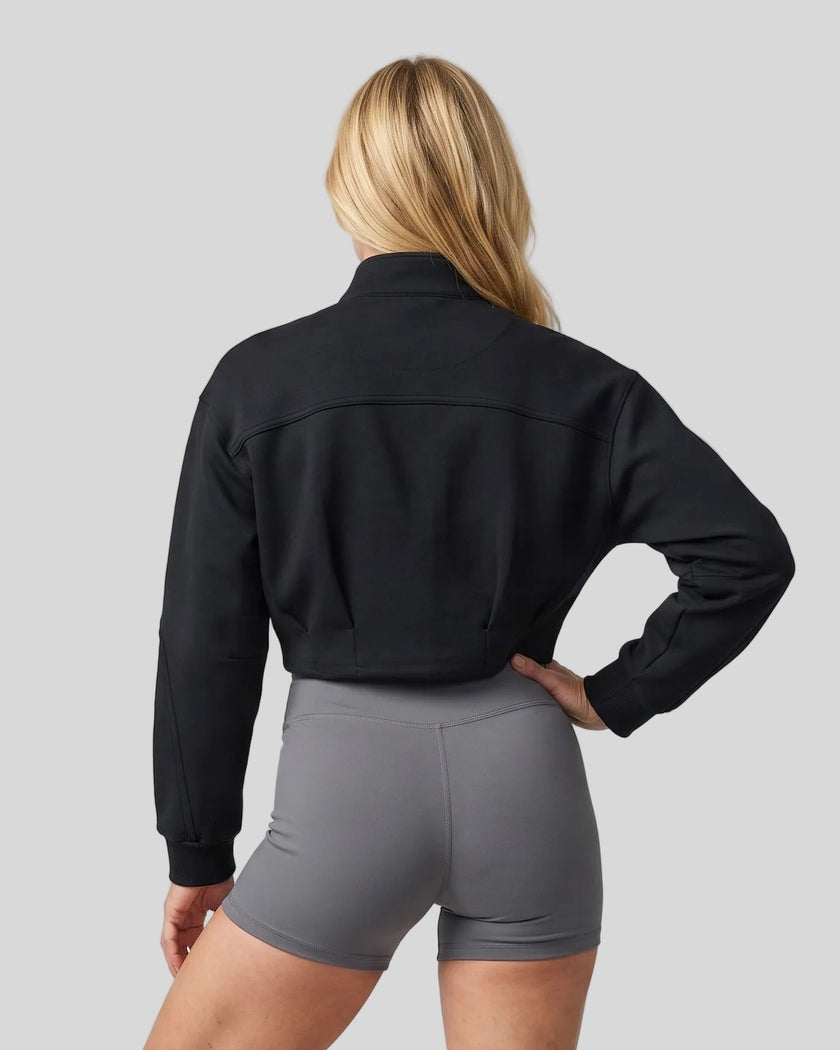 Upper body back view of woman wearing ContourEase Stand Collar Jacket in Black