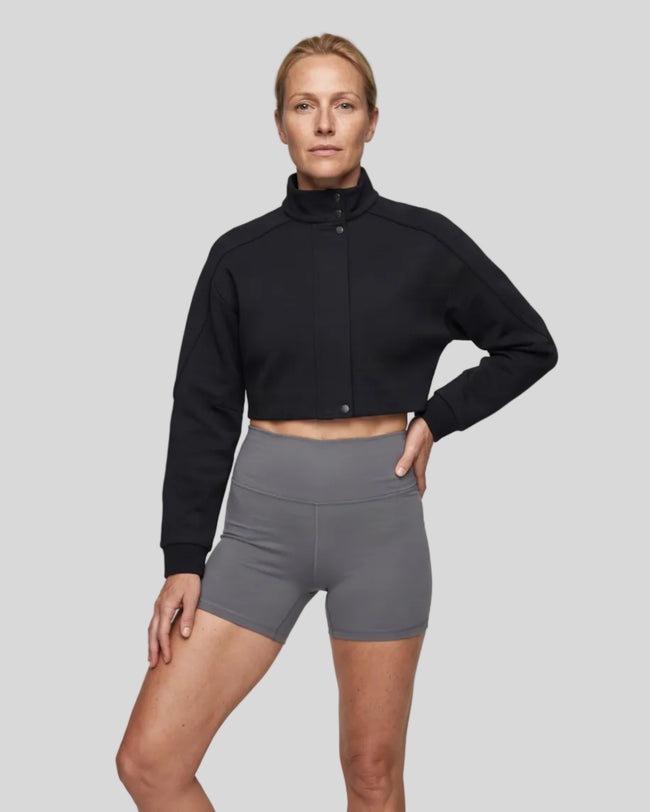 Upper body front view of woman wearing ContourEase Stand Collar Jacket in Black
