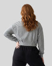 Upper body back view of curvy woman wearing ContourEase Stand Collar Jacket in Flower Gray