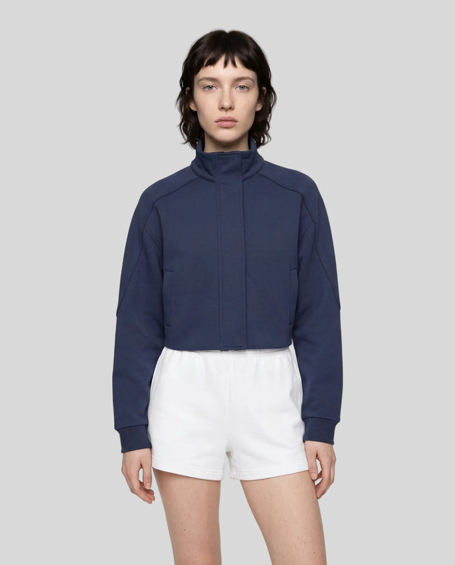Upper body front view of woman wearing ContourEase Stand Collar Jacket in Navy Blue