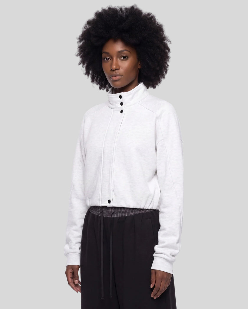 Upper body front angle view of woman wearing ContourEase Stand Collar Jacket in Oat Gray