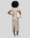 Woman wearing the ContourEase V-Neck Maxi Dress in Light Gray, back view showing streamlined fit and back slit