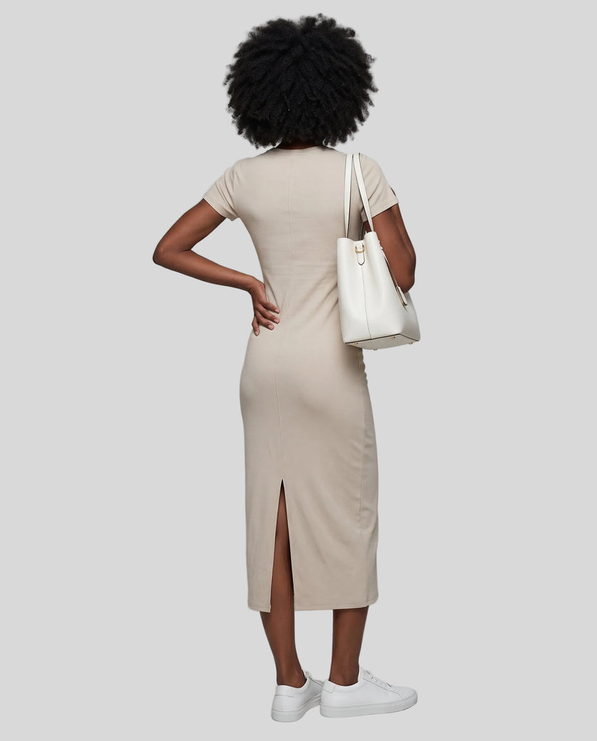 Woman wearing the ContourEase V-Neck Maxi Dress in Light Gray, back view showing streamlined fit and back slit