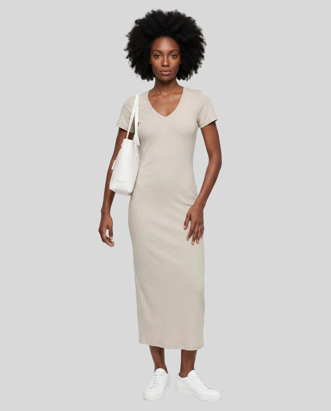 Woman wearing the ContourEase V-Neck Maxi Dress in Light Gray, front view showing V-neckline and slim fit