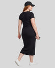 Woman wearing the ContourEase V-Neck Maxi Dress in Black, back angle view showing streamlined fit and back slit