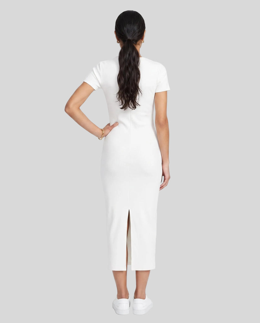Woman wearing the ContourEase V-Neck Maxi Dress in White, back view showing streamlined fit and back slit