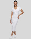 Woman wearing the ContourEase V-Neck Maxi Dress in White, front view showing V-neckline and slim fit