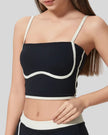 Detailed angled closeup of contrast trim and neckline on black active cami Athlesi