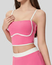 Angled front view of ContourEdge fuchsia pink active cami with longline silhouette