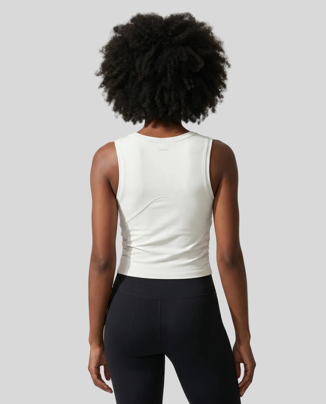 Back view of the ContourForm Studio Tank in beige