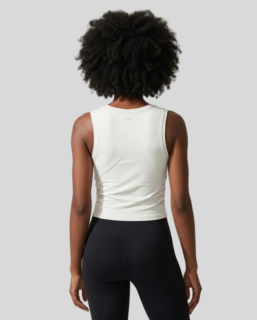Back view of the ContourForm Studio Tank in beige