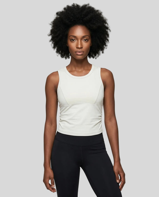 Model wearing the ContourForm Studio Tank in beige front view