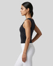 Side profile of the ContourForm Studio Tank in black, showing the contoured silhouette