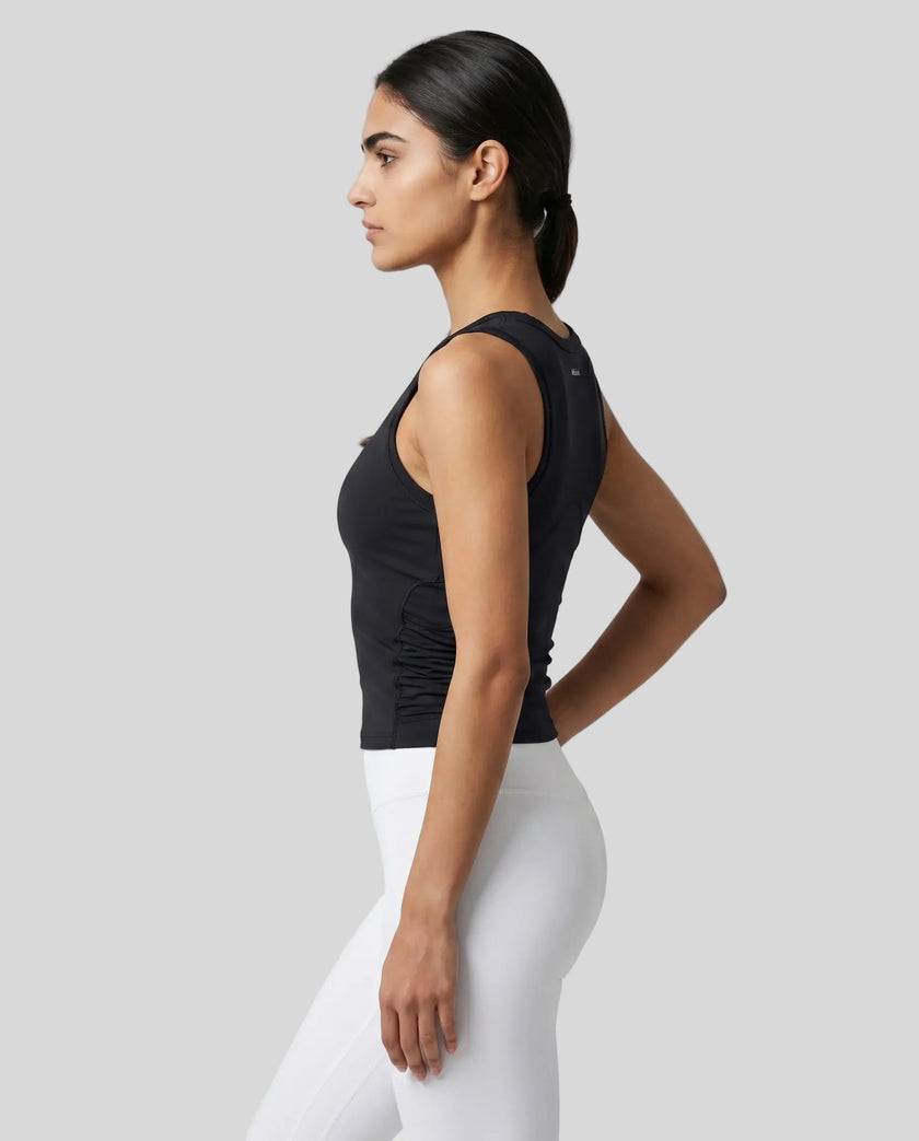 Side profile of the ContourForm Studio Tank in black, showing the contoured silhouette