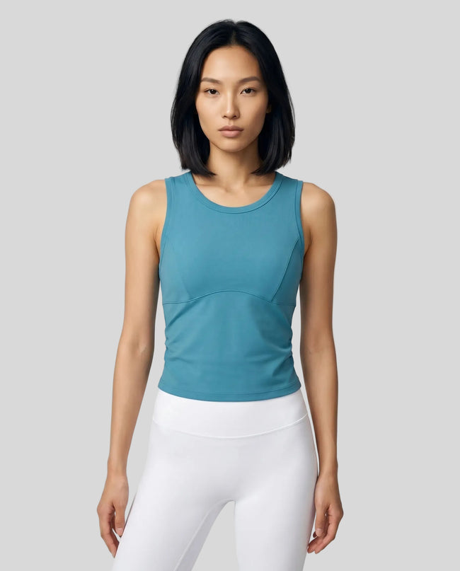 Model wearing the ContourForm Studio Tank in lake blue front view