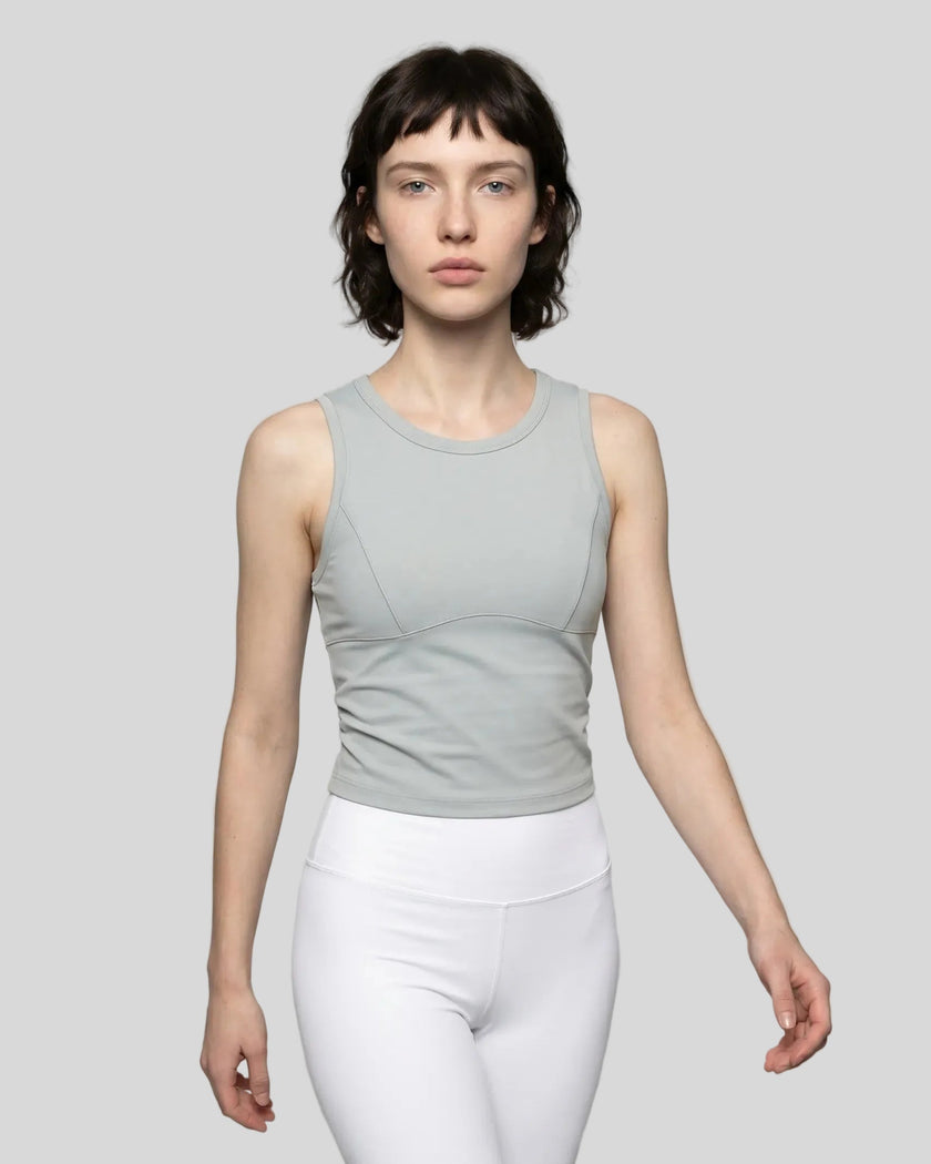 Model wearing the ContourForm Studio Tank in light gray front view