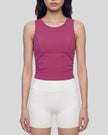 Model wearing the ContourForm Studio Tank in rose red front view