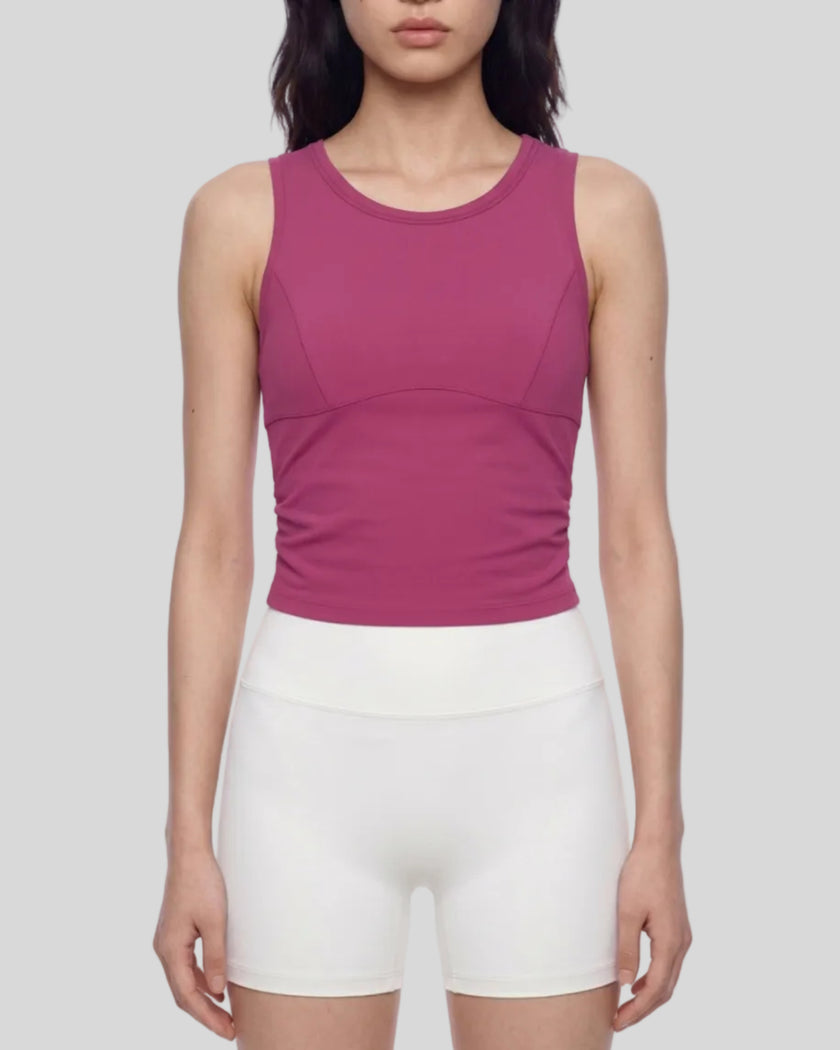 Model wearing the ContourForm Studio Tank in rose red front view