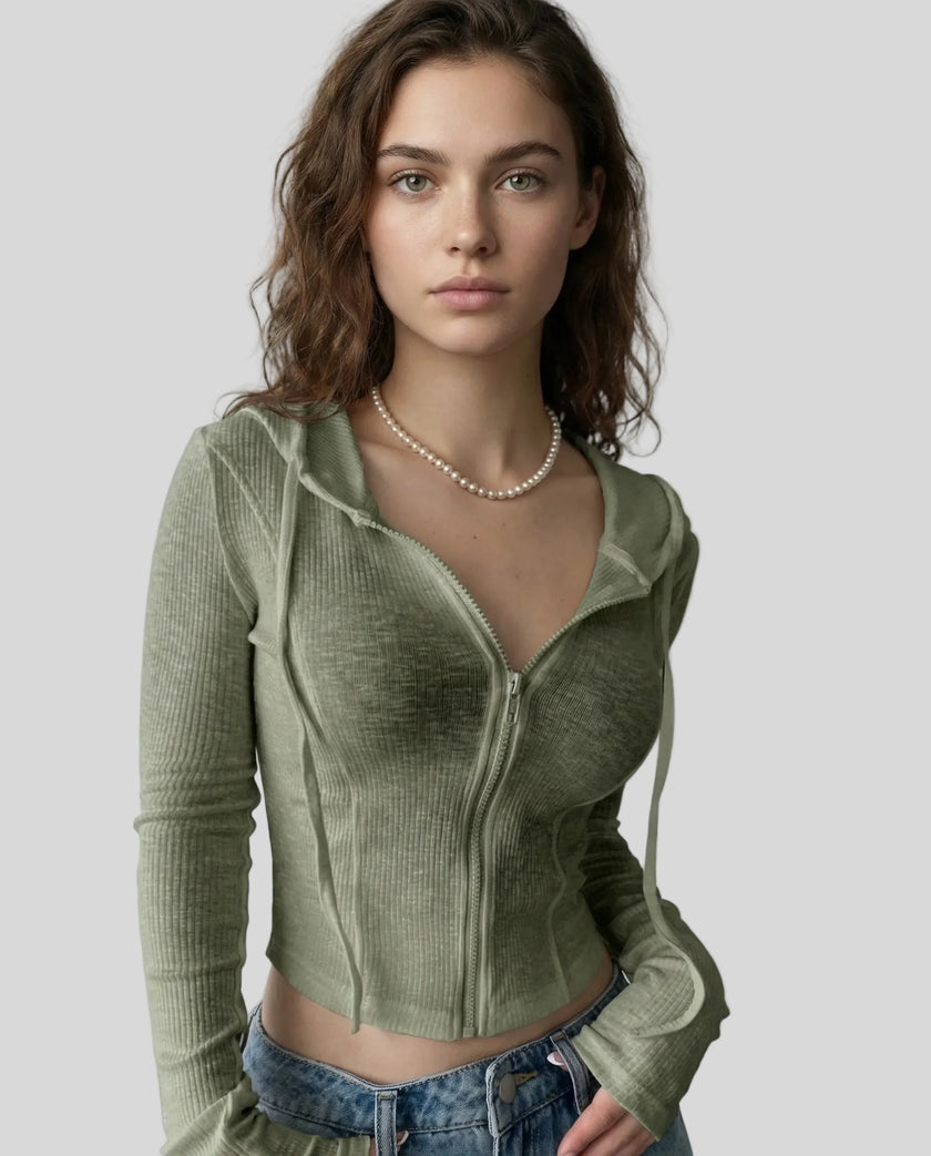 Mid shot of model wearing an army green ContourZip Ribbed Jacket with jeans in a clean studio setting