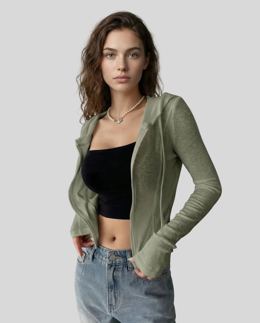 Mid shot angled view of model wearing an open front army green ContourZip Ribbed Jacket with jeans in a clean studio setting