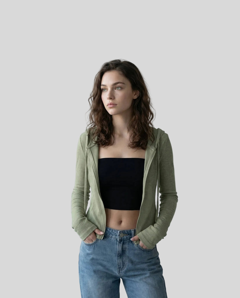 Mid shot of model wearing an open front army green ContourZip Ribbed Jacket with jeans in a clean studio setting