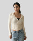 Mid shot of model wearing a khaki ContourZip Ribbed Jacket with jeans in a clean studio setting