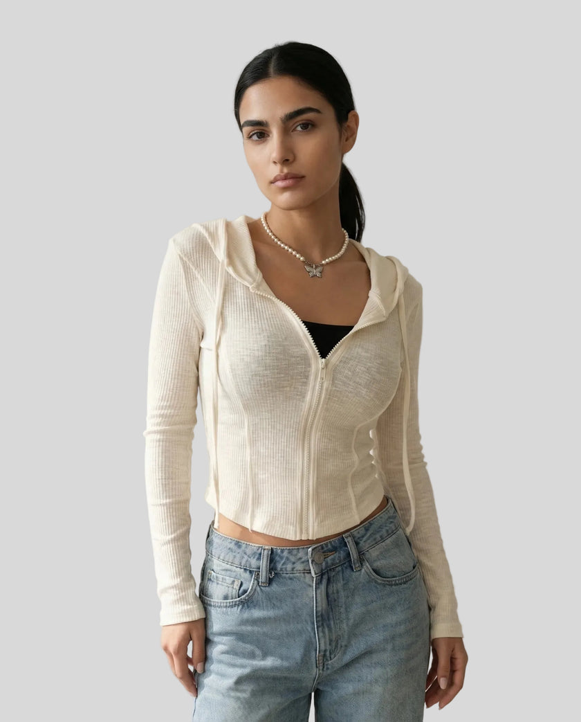 Mid shot of model wearing a khaki ContourZip Ribbed Jacket with jeans in a clean studio setting