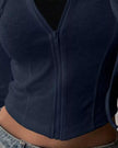 ContourZip Ribbed Jacket in navy close-up showing zipper and ribbed waist detail